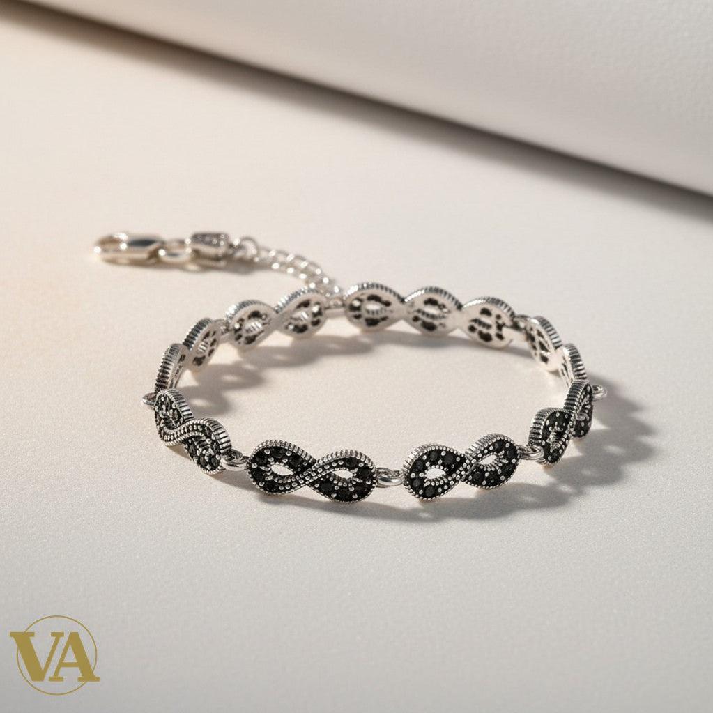 Bracelet femme Vindicta en argent 925, motif infini serti de marcassites, style vintage, fermoir mousqueton.