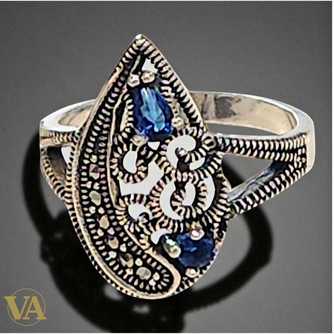 Bague argent 925 ajourée pierres bleues et marcassites .