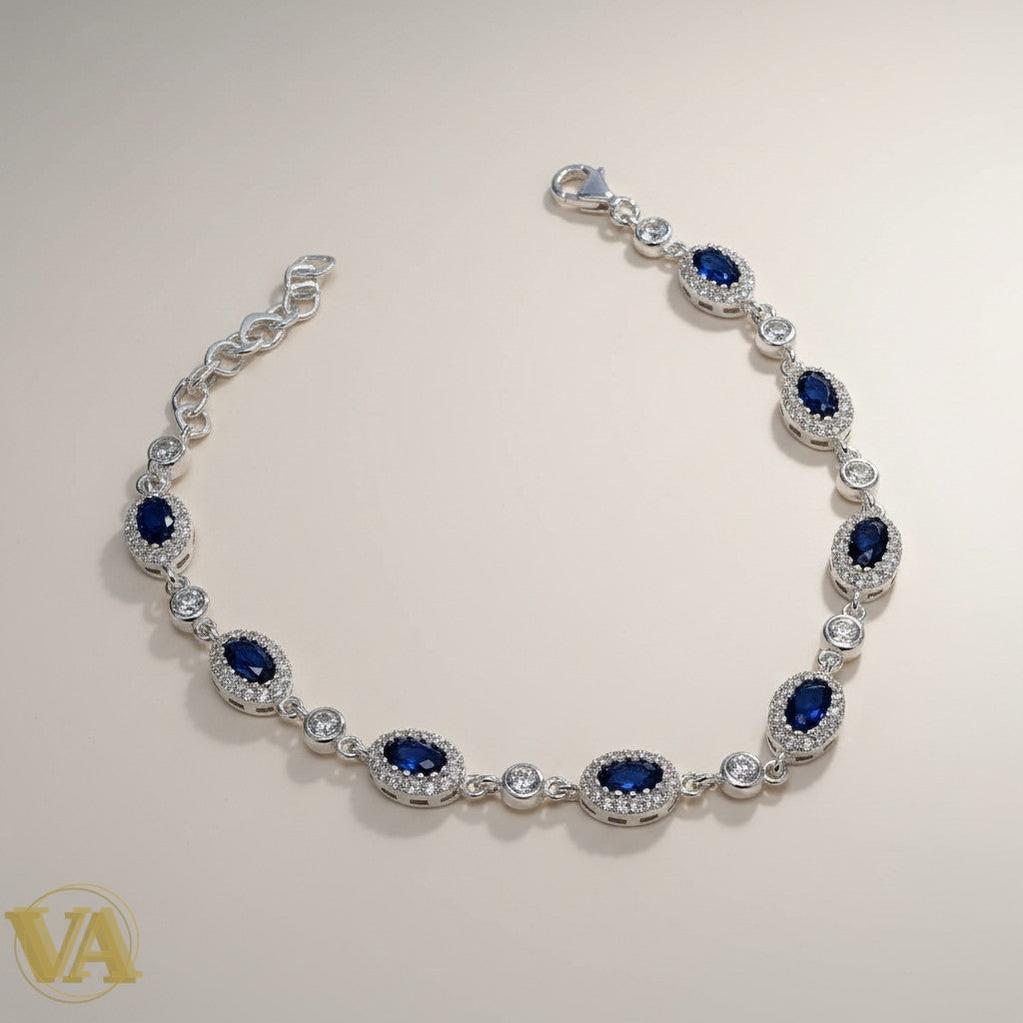 Bracelet Vindicta en argent 925 avec oxydes bleus ovales et blancs, chaîne d'extension, fermoir mousqueton.